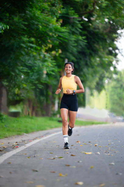 istock beautiful young woman going for a run on a sunny day 2178393771