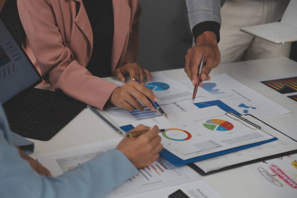 istock Close up of Business team analyzing income charts and graphs with modern laptop computer. Business analysis and strategy concept. 2178394798