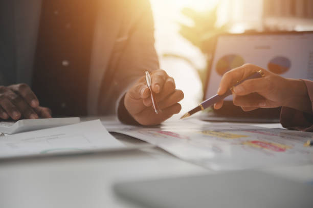 istock Close up of Business team analyzing income charts and graphs with modern laptop computer. Business analysis and strategy concept. 2178394872