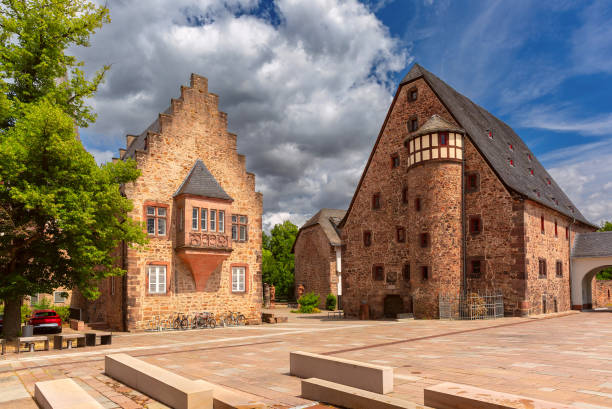 Deutsches Haus, a historic half-timbered building in Marburg, Germany, illuminated at dusk
