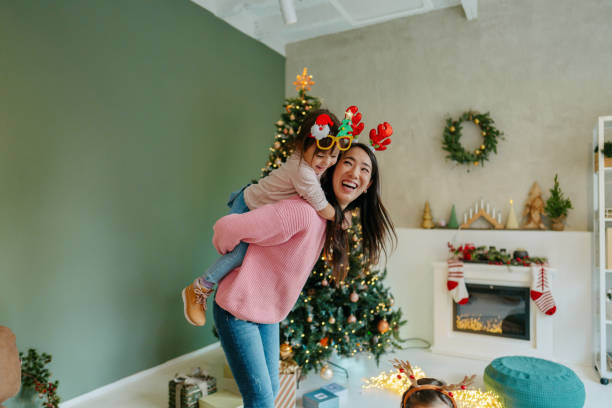 istock Mother and daughter having fun on Christmas Day 2178395936