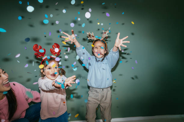 istock Mother and daughters having fun on Christmas Day 2178395952