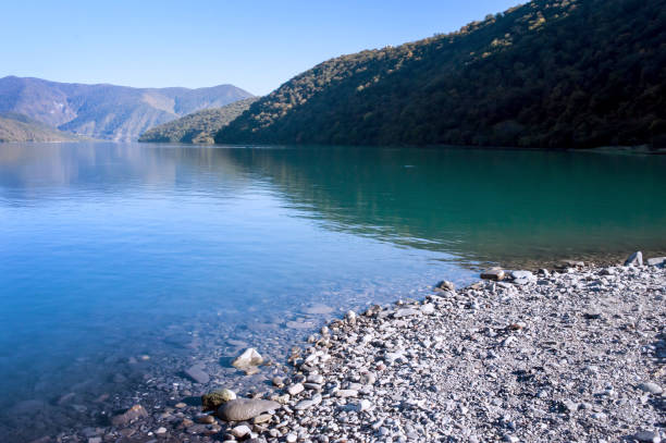 istock Beautiful mountain lake with rocky shore 2178396657