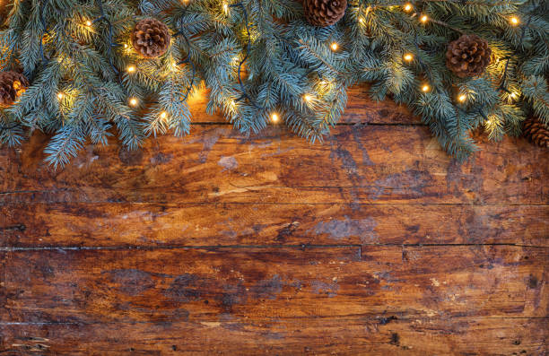 istock Christmas garland on a rustic wooden backdrop 2178398419