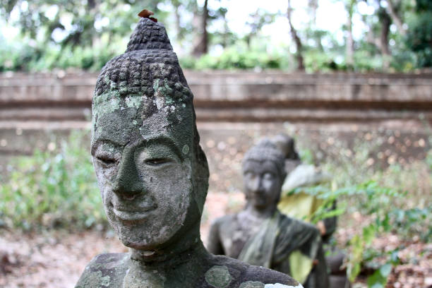 istock Crumbling, eroded Buddhas at Wat Umong 2178399328