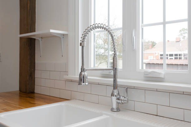 istock Modern White Kitchen Faucet With Chrome Finish And Sink 2178399589
