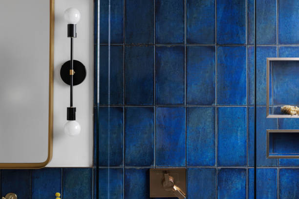 istock Blue Tiled Bathroom Wall With Modern Lighting Fixture 2178399784