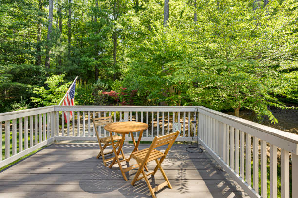 istock Serene Outdoor Deck With Wooden Table And Chairs. 2178399971