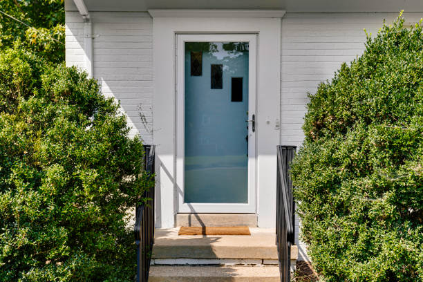 istock Front Door Entrance With Hedges And Concrete Steps 2178400887