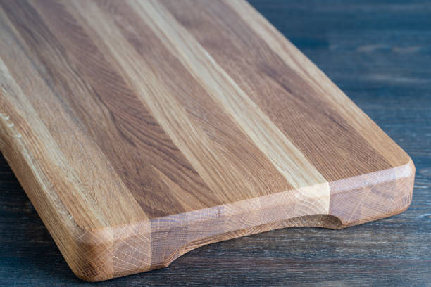 istock Wooden cutting board on wooden table background 2178400920