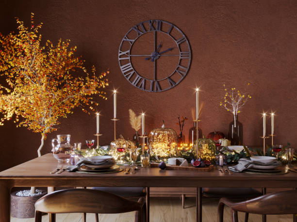 Autumn Thanksgiving Dining Table Setting on a Wooden Rustic Table. Fall Table Decoration with Pumpkins, Branches, Berries, Candles and Wine.