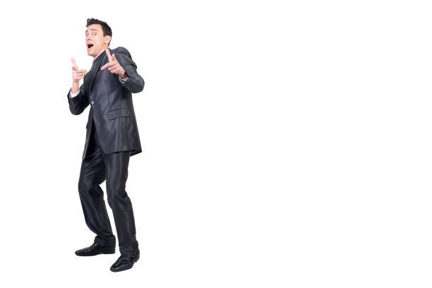 Full body of handsome male entrepreneur showing you gesture and pointing at camera on white background in studio