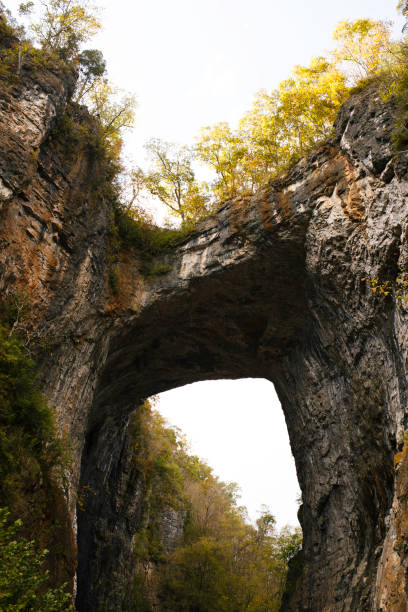 istock Majestic Natural Rock Bridge With Vibrant Autumn Trees 2178405461