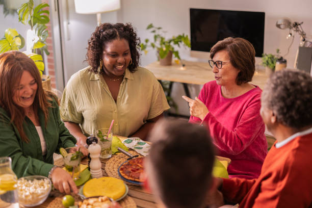 istock Group of multiethnic friends having dinner together at home 2178406481