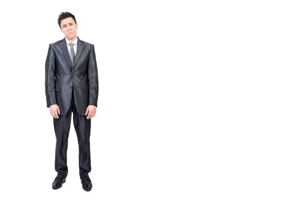 istock Tired young businessman standing isolated on white background 2178407369