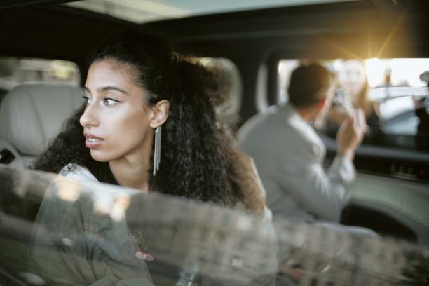 istock Middle Eastern Female Celebrity Sitting in Car Looking out from Window 2178407964