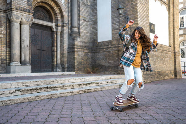 istock Woman enjoying riding a skateboard 2178411578