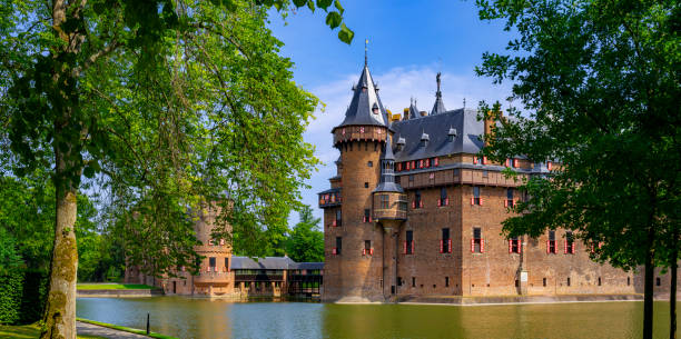 Helmond, The Netherlands, August 16, 2019: view of the walls and towers of the 14th century castle and its surrounding moat form the north west