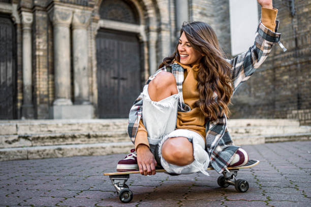istock Woman enjoying riding a skateboard 2178412793