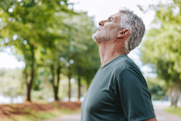 istock Portrait of senior man breathing fresh air in nature 2178413038