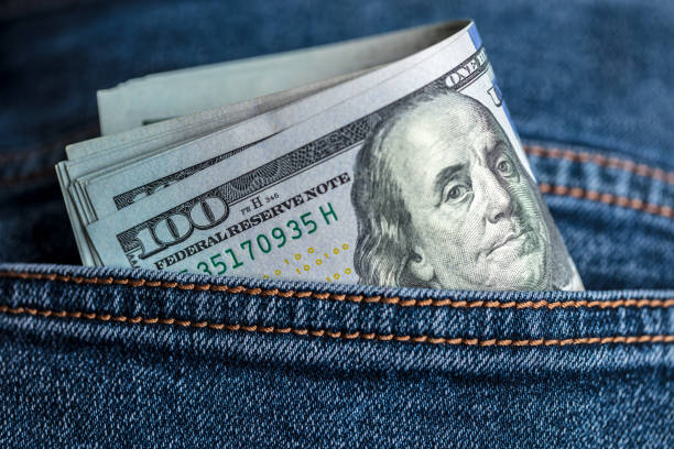 istock Dollar bills in jeans pocket 2178414480