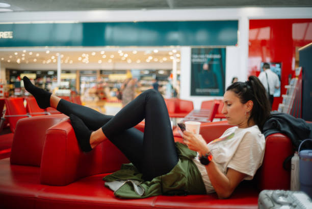 istock Reading stuff on the phone while waiting for the flight at the airport 2178414730