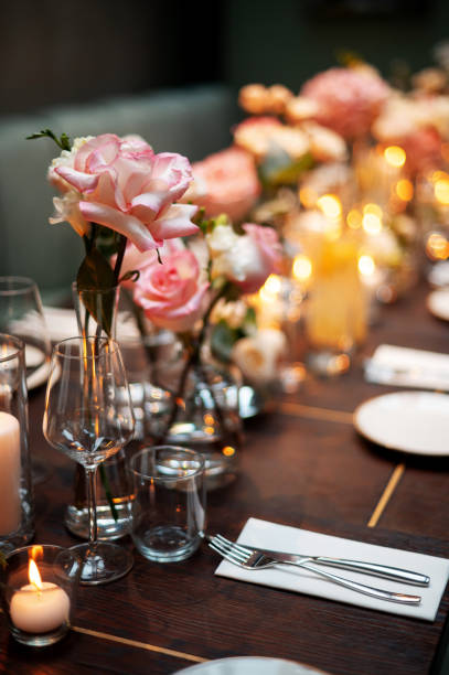 istock Elegant Dining Table with Floral Centerpieces 2178417082