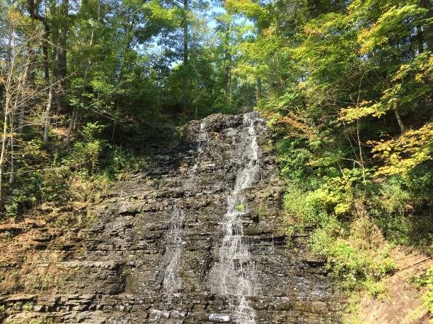 During a dry spell, a trickle of water flows down the rocks.