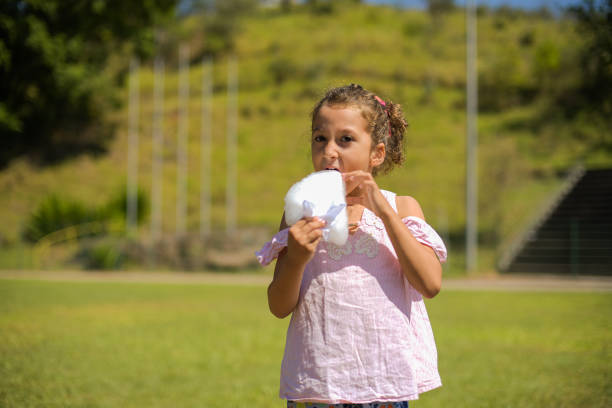 Girl outside eating cotton candy