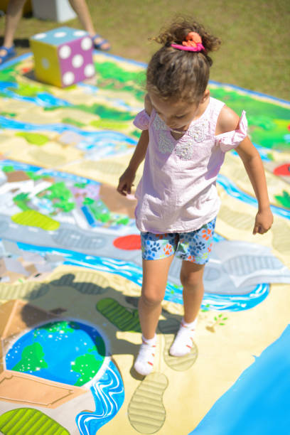 istock Toddler girl walking on playground board 2178419252