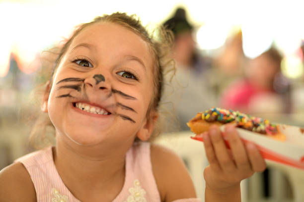 Little girl child eating candy