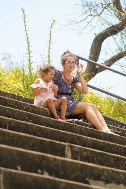 istock mother and daughter playing in the stands 2178419720