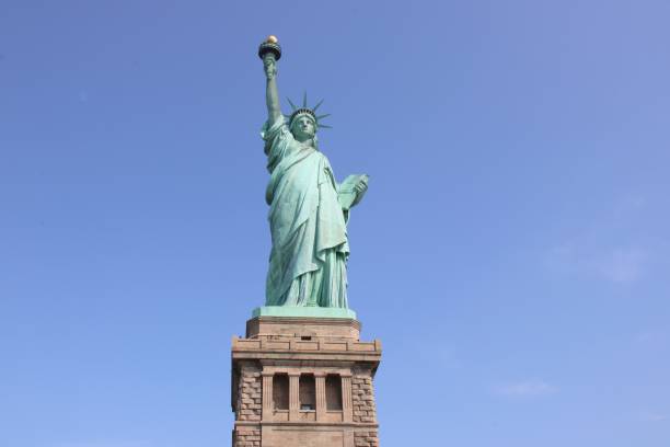 istock Statue of Liberty under a clear blue sky 2178426432