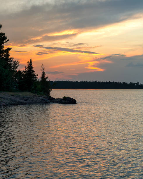 istock Northwoods Sunset Over Water - Vertical 2178426552