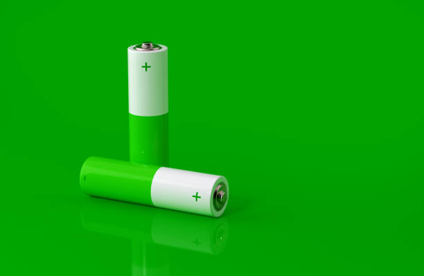 istock Green And White Colored Batteries On Green Background 2178427572