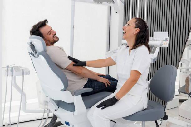 istock Patient enjoys a lighthearted moment with a dentist during an appointment in a modern clinic 2178430025