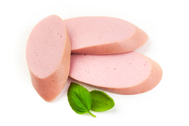 istock Fresh Boiled sausage slices with basil leaves, isolated on white background. 2178431510