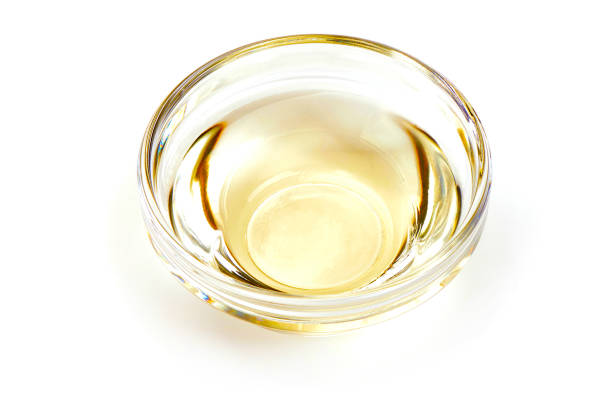 istock Apple vinegar in glass bowl closeup, isolated on white background 2178431937