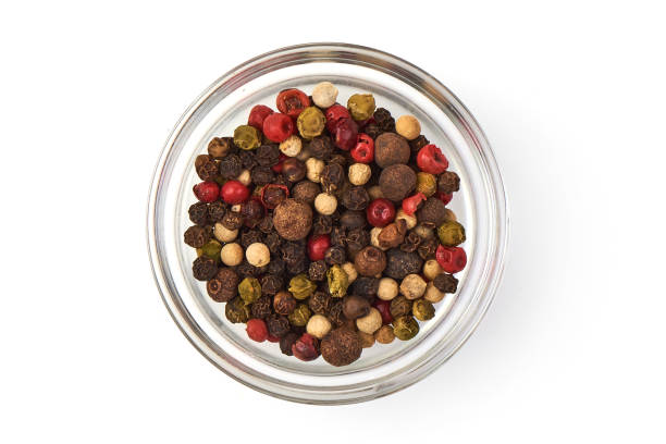 istock Pepper mix. Black, red and white peppercorns in a transparent cup, isolated on white background. Top view. Close-up 2178432911