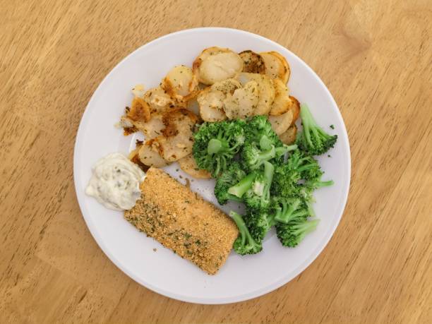 Healthy baked fish dinner and broccoli