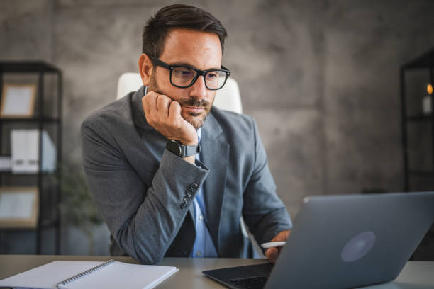 istock confident businessman work on new project on laptop in modern office 2178436789