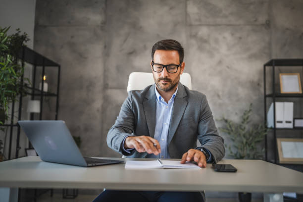 istock confident businessman work on new project on notebook in modern office 2178436857