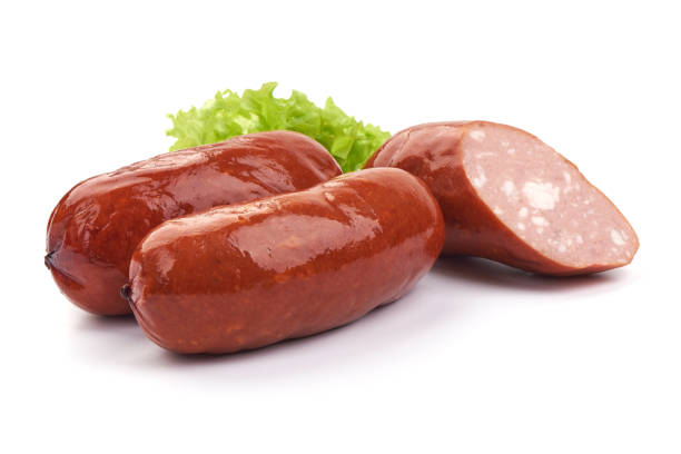 Bavarian Grilled Sliced Sausages with lettuce, Close-up, isolated on a white background