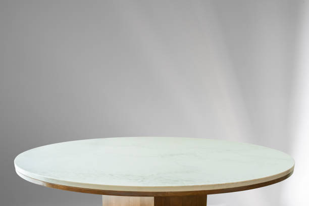 istock Round marble table top with abstract shadow drop on white wall background for mockup product display 2178442521