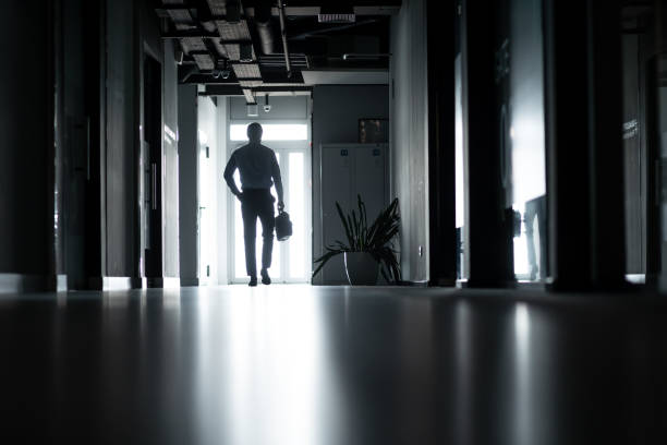 Queenstown, Maryland, USA  Sept 2, 2024 A man in silhouette walks in a passage at the Queenstown Premium Outlet