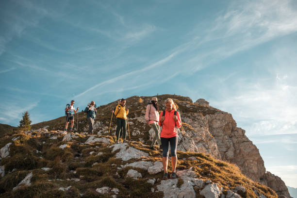 istock Diverse Friends Trekking Mountain Ridge with Backpacks 2178443506
