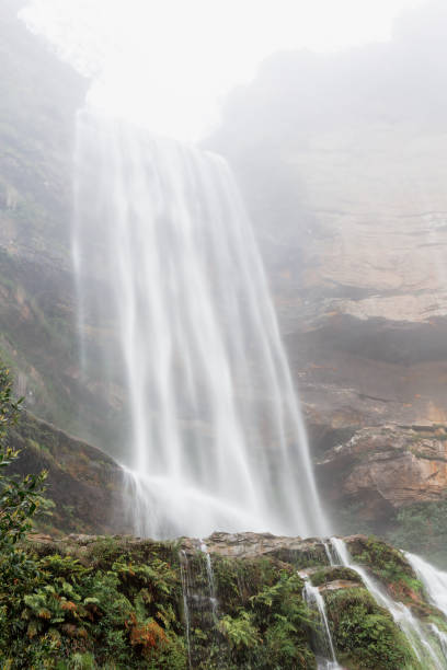 istock Cloud mist and majestic waterfall flowing off a high cliff 2178443641