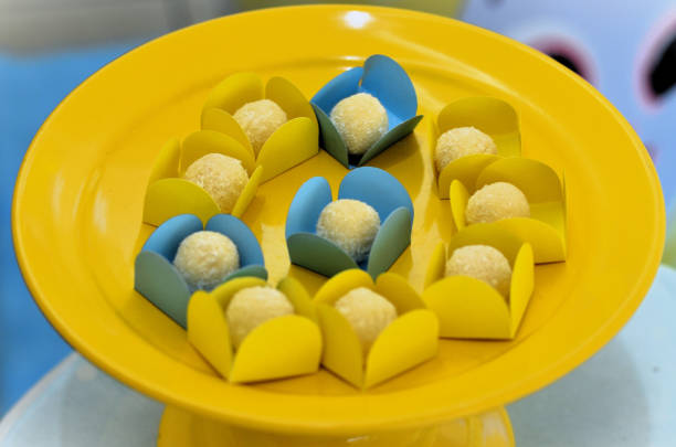 istock Yellow plate with delicious powdered milk sweets 2178443684