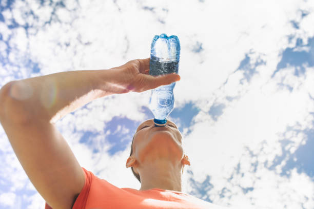 istock Woman refreshing herself in a hot summer day. 2178444988