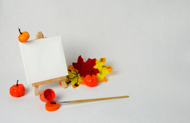 still life with traditional broom, incense, pine cones, red rose petals